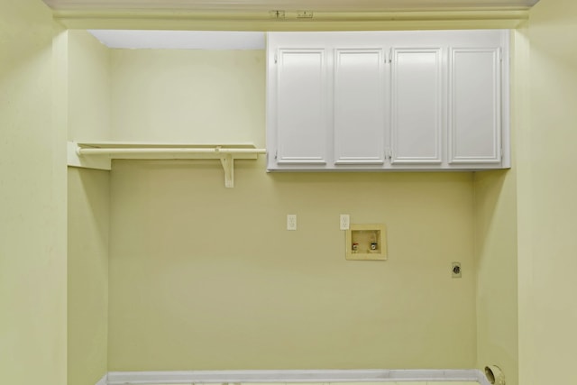 washroom with electric dryer hookup, cabinets, and hookup for a washing machine