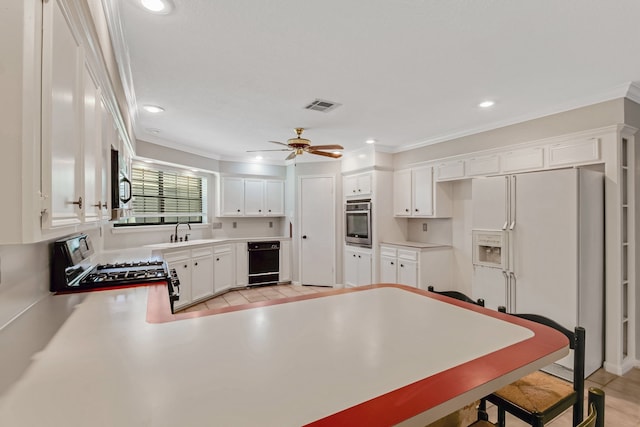 kitchen featuring white cabinetry, crown molding, appliances with stainless steel finishes, and ceiling fan