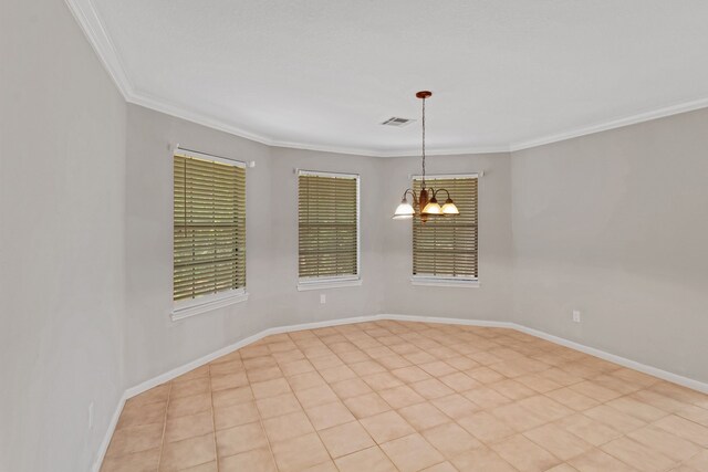 tiled empty room with ornamental molding and an inviting chandelier