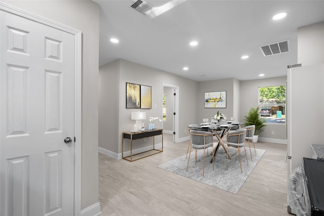 dining area with light hardwood / wood-style flooring