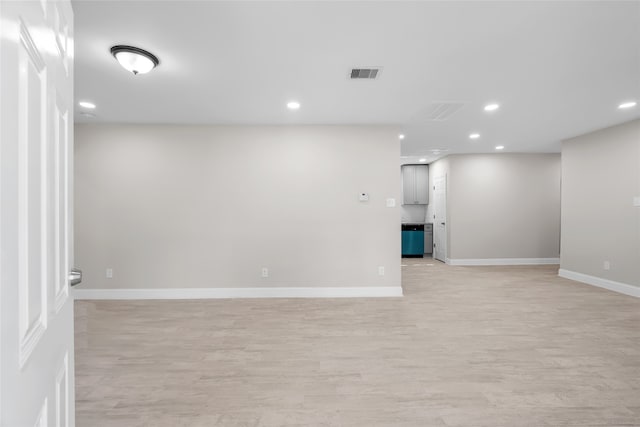 basement with light hardwood / wood-style floors