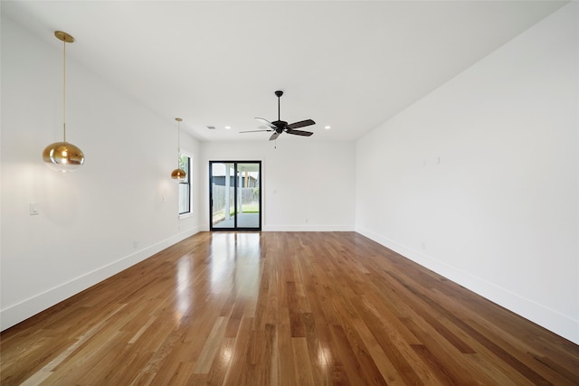 empty room featuring ceiling fan and hardwood / wood-style flooring