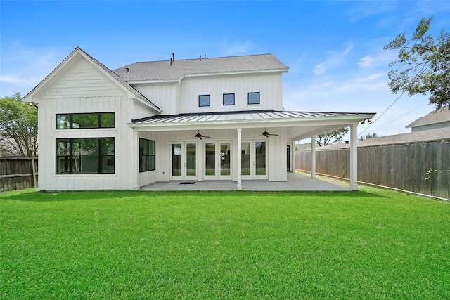 rear view of house with a patio, a yard, and ceiling fan