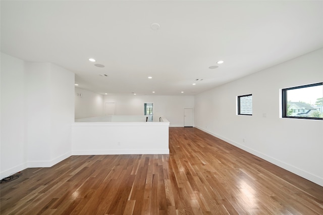 unfurnished living room with hardwood / wood-style flooring