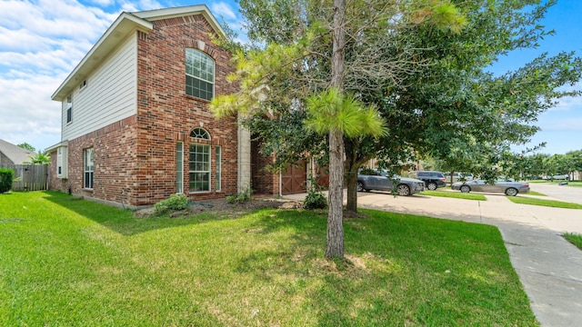 view of home's exterior with a lawn