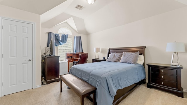 bedroom featuring vaulted ceiling and light colored carpet