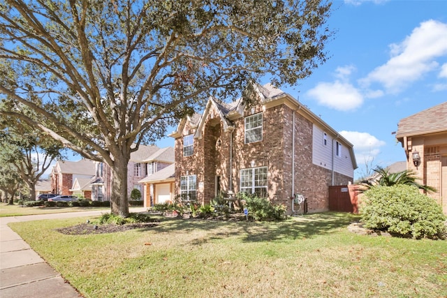 front of property with a garage and a front lawn