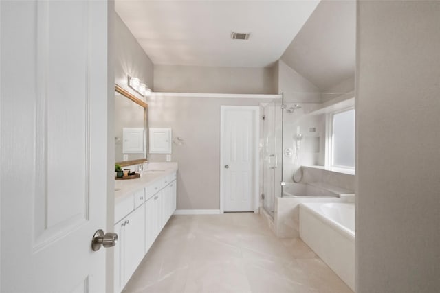 bathroom with tile patterned flooring, vanity, and separate shower and tub