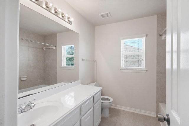 full bathroom with tile patterned flooring, vanity, toilet, and tiled shower / bath combo