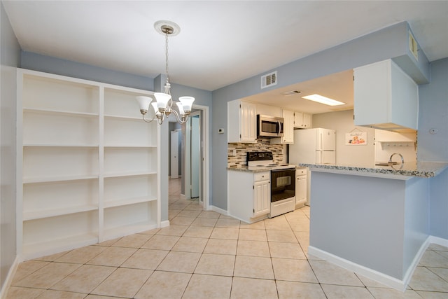 kitchen featuring light tile patterned floors, decorative backsplash, white appliances, light stone countertops, and kitchen peninsula