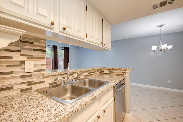 kitchen featuring light stone counters, backsplash, white cabinetry, light tile patterned flooring, and dishwasher