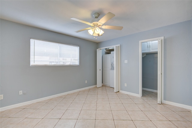 unfurnished bedroom featuring light tile patterned flooring and ceiling fan