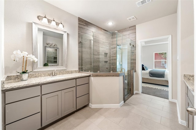 bathroom with vanity, tile patterned floors, and an enclosed shower