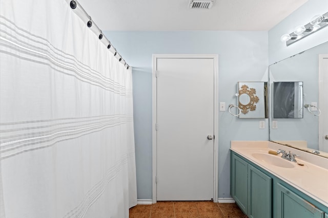 bathroom featuring vanity and tile patterned flooring