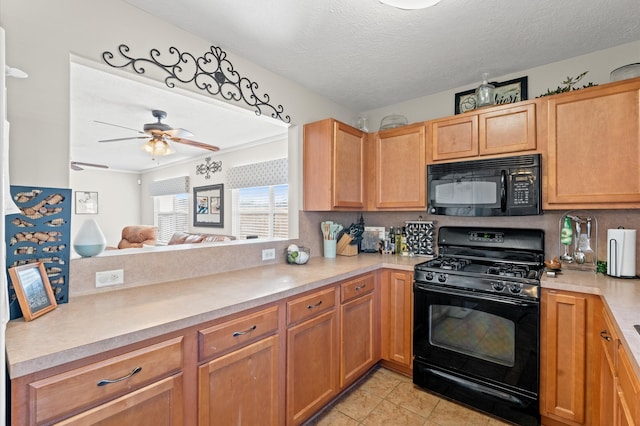 kitchen featuring light tile patterned floors, black appliances, a textured ceiling, and ceiling fan