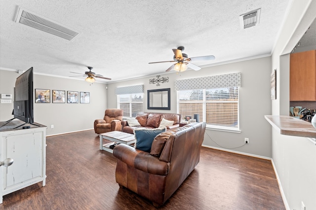 living room featuring crown molding, a textured ceiling, dark hardwood / wood-style flooring, and ceiling fan