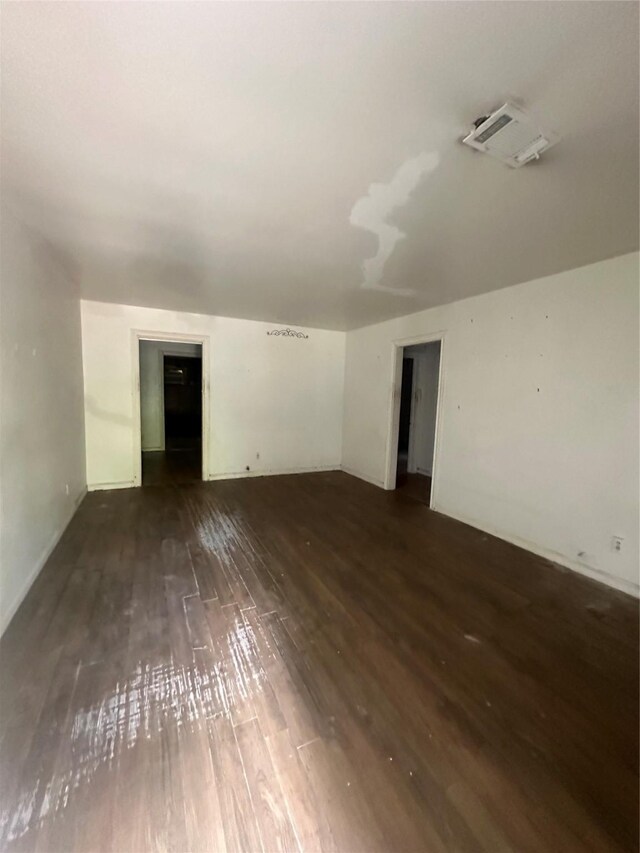 spare room featuring wood-type flooring