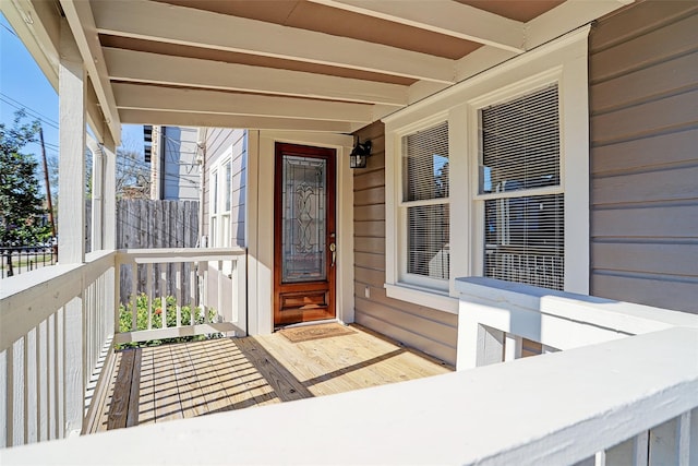 view of exterior entry with covered porch