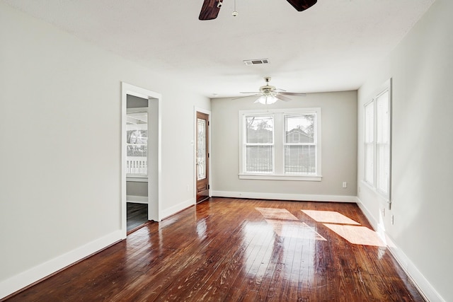 spare room featuring wood-type flooring and ceiling fan