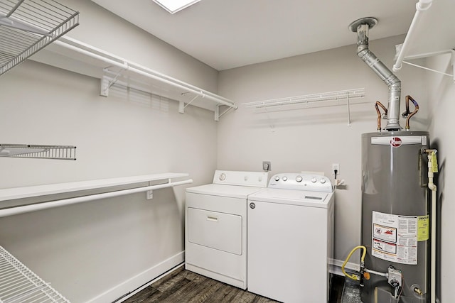 laundry area featuring dark hardwood / wood-style floors, washer and clothes dryer, and water heater