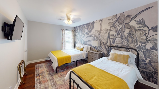 bedroom with dark wood-type flooring and ceiling fan