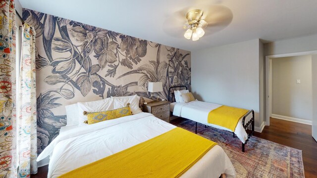 bedroom featuring dark wood-type flooring and ceiling fan