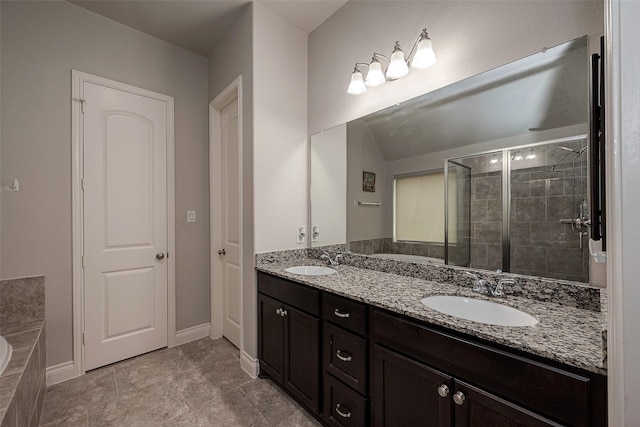 full bathroom with a sink, a stall shower, double vanity, and a bath