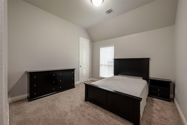 bedroom with visible vents, lofted ceiling, carpet, and baseboards