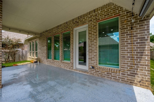 view of patio / terrace featuring fence