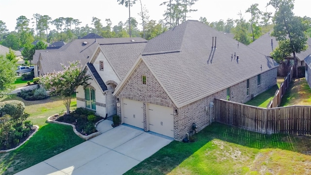 view of front facade with a garage and a front yard