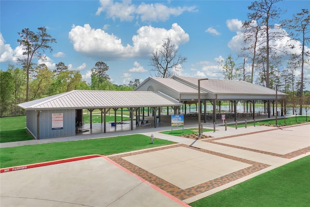 view of property's community featuring a yard