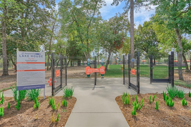 view of property's community featuring a gate and fence