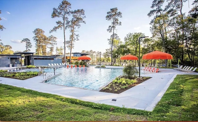 view of home's community featuring a pool