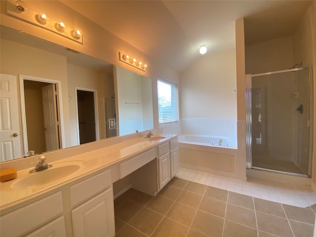 bathroom with shower with separate bathtub, tile patterned flooring, vaulted ceiling, and vanity