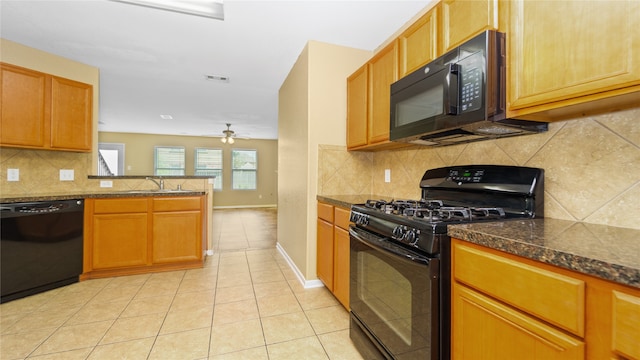 kitchen featuring ceiling fan, kitchen peninsula, black appliances, light tile patterned floors, and backsplash