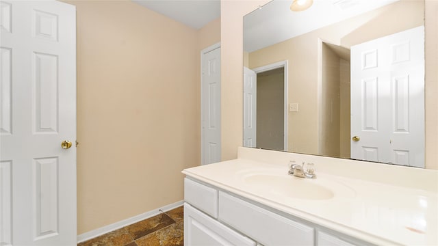 bathroom featuring tile patterned floors and vanity