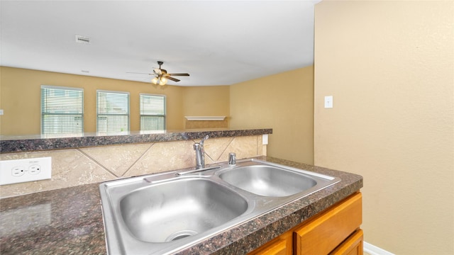 kitchen featuring sink and ceiling fan