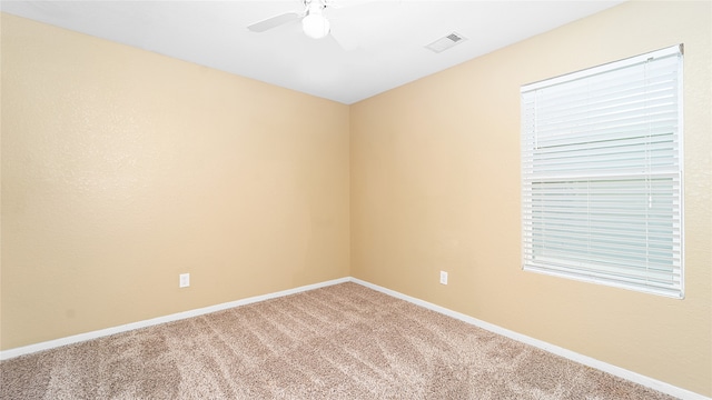 carpeted empty room with ceiling fan