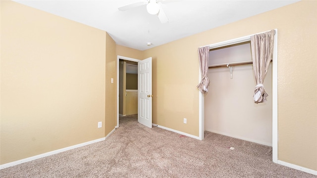 unfurnished bedroom with ceiling fan, light colored carpet, and a closet