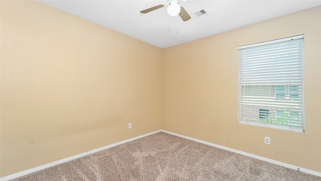 spare room with ceiling fan and carpet flooring