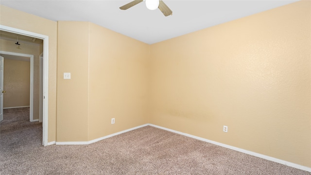 unfurnished room with ceiling fan and carpet flooring