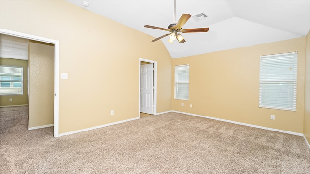 unfurnished bedroom featuring ceiling fan, high vaulted ceiling, light colored carpet, and a closet