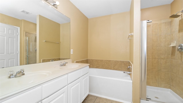 bathroom featuring vanity, tile patterned floors, and shower with separate bathtub