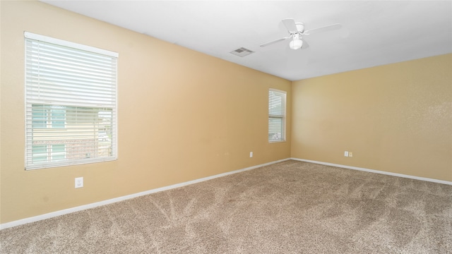 spare room with ceiling fan and carpet flooring