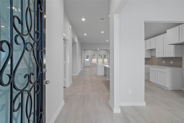 entryway with light hardwood / wood-style floors