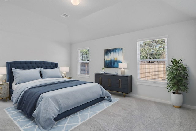 carpeted bedroom featuring vaulted ceiling