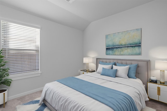 carpeted bedroom featuring vaulted ceiling