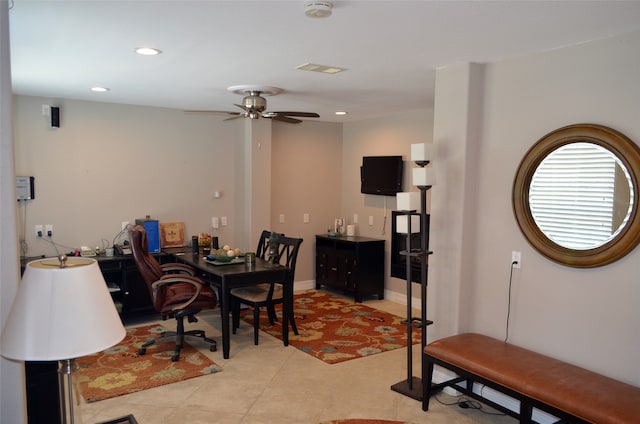 tiled dining room with ceiling fan