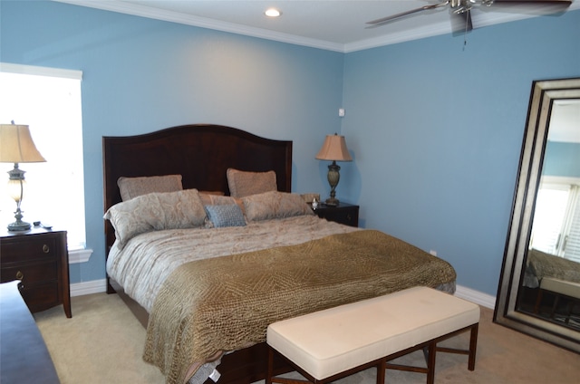 bedroom featuring light carpet, ceiling fan, and ornamental molding