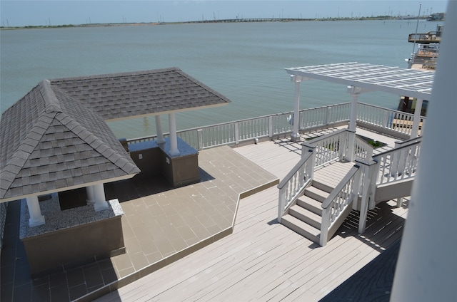 exterior space with a water view and a gazebo